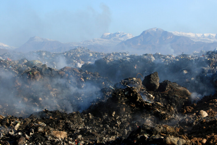Garbage is seen collected from an area which used to be a landfill and will be diverted into a green park, in Zakho, district of Dohuk